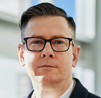 Alexander Hughes, CEO di un'azienda di crypto trading, ritratto